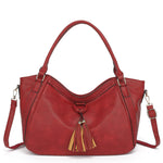 Red handbag with gold accents on a white background