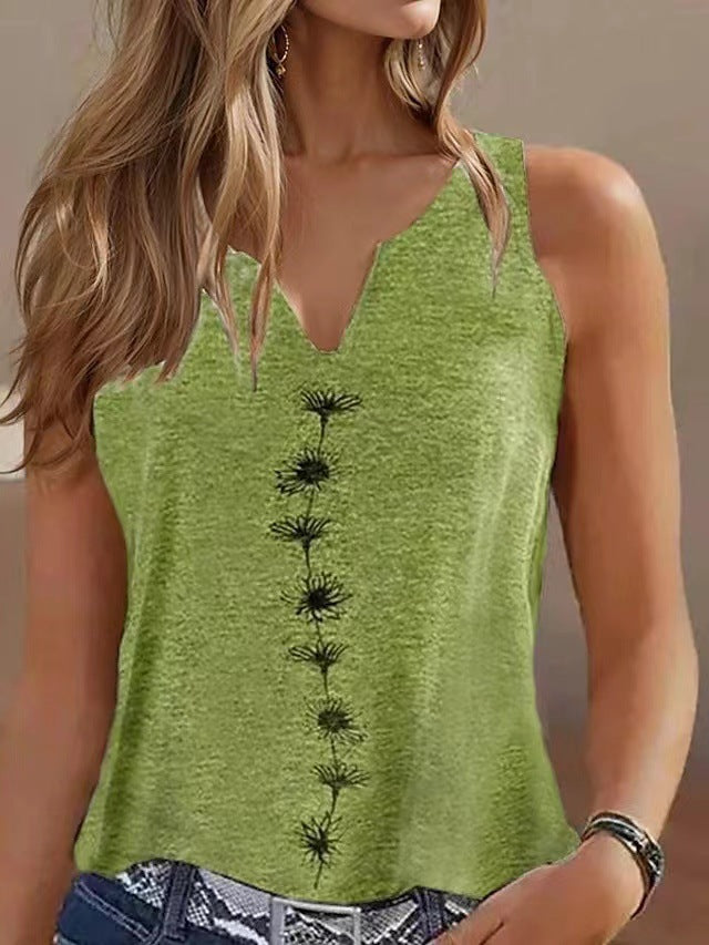 Green tank top with black floral patterns worn by a person