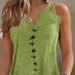 Green tank top with black floral patterns worn by a person