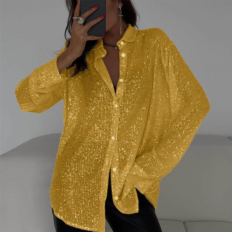 Person wearing a yellow sequin shirt against a neutral background