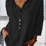 Solid color button-down shirt displayed flat with accessories
