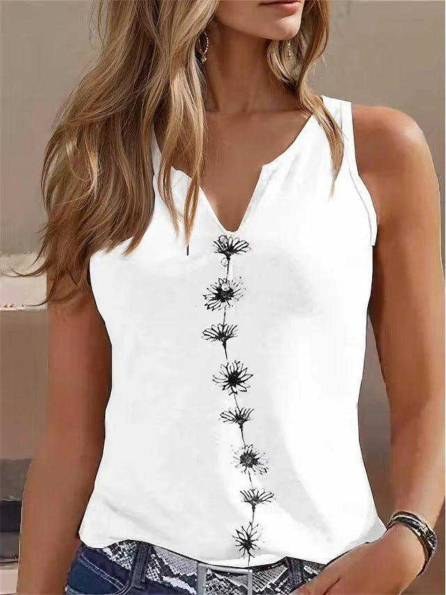 White sleeveless top with black floral patterns worn by a person.